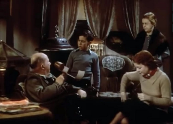 Family sitting around living room